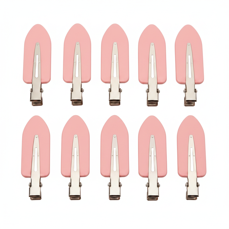 Pink hair clips on white background